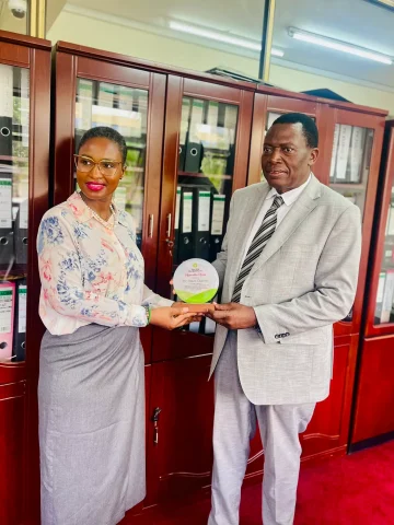 "Collaborative meeting between Ms. Susan Wilkinson and Dr. Charles Olaro, the Director General of Health Services at the Ministry of Health, Uganda